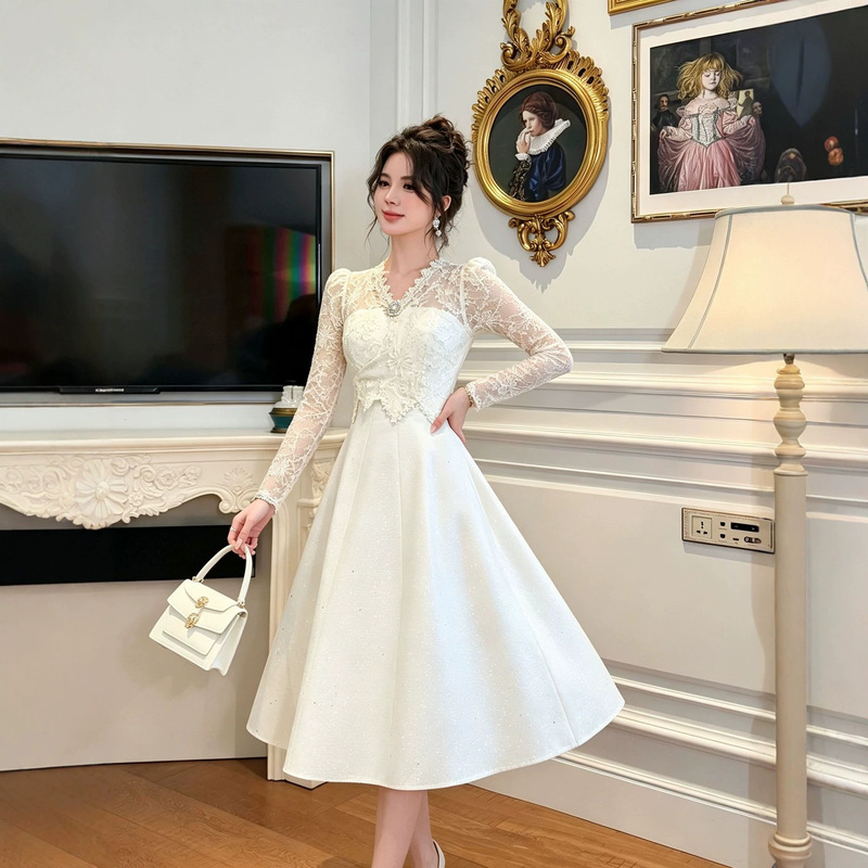 Elegant lace dress with long sleeves, a fitted waist, and a slimming effect, a mid-length party dress with a flared skirt, style 21956
