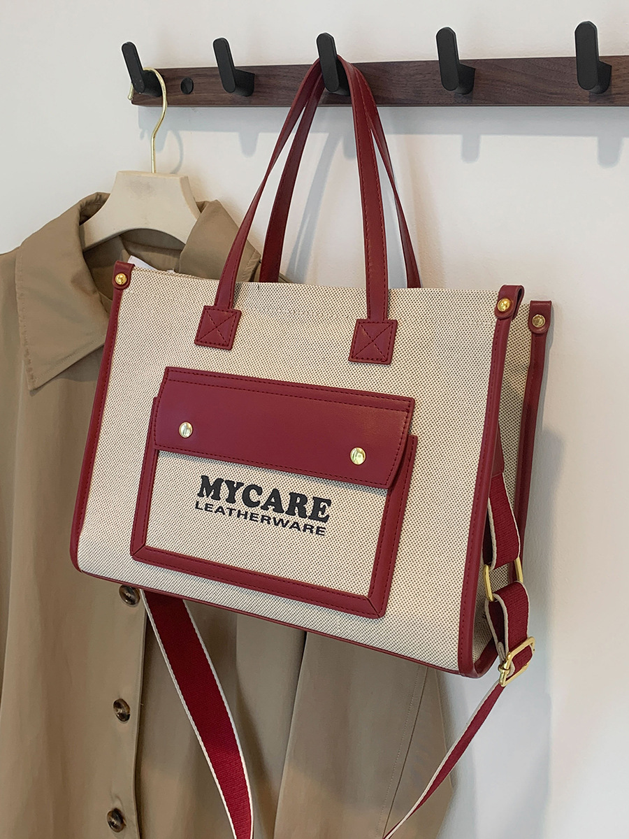 Bolso de lona de gran capacidad para mujeres 2024 nueva moda color contrastante empalme mochila de hombro simple bolsa de mano casual