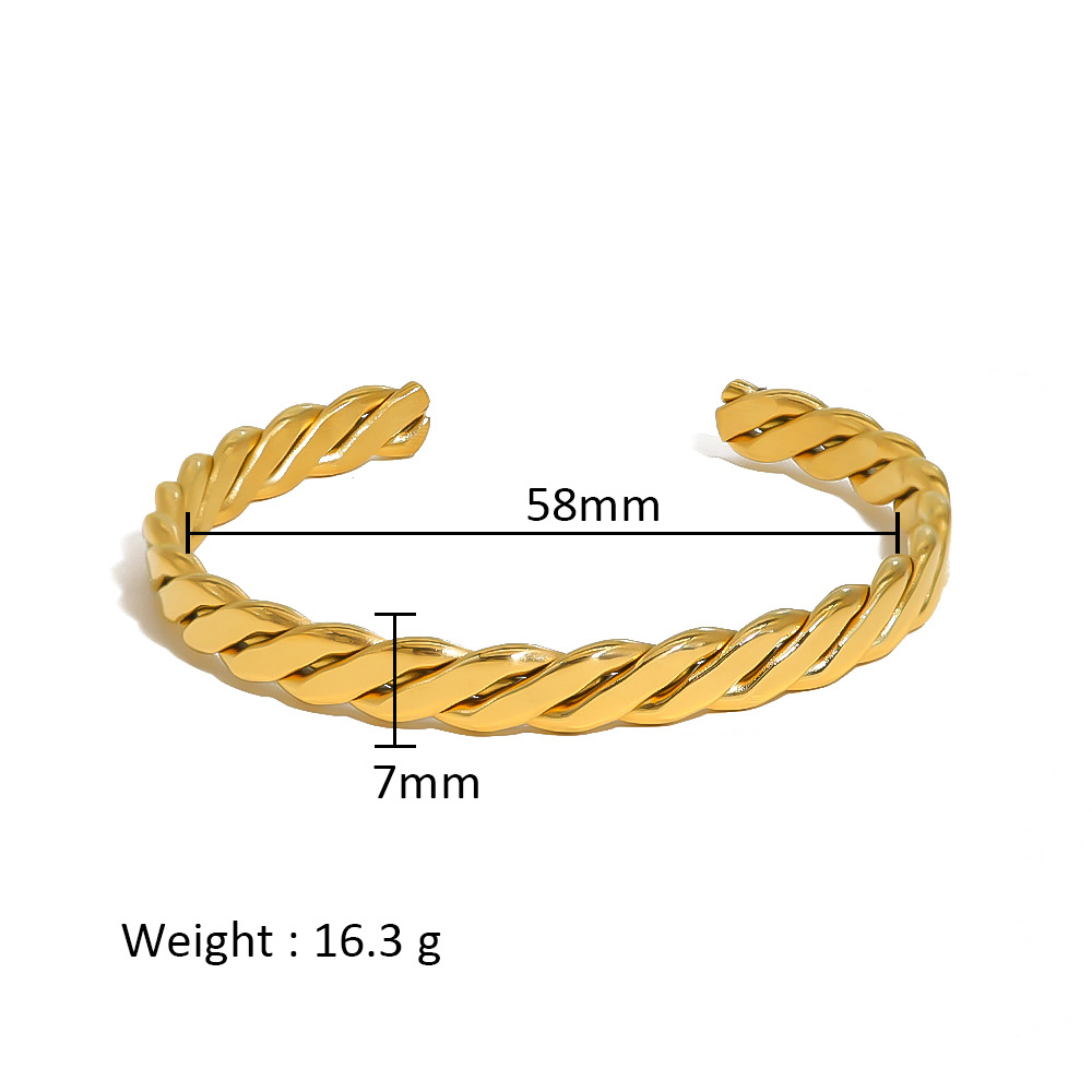 Ins pulsera de apertura de giro tejida en forma de C de galvanoplastia de oro real de acero inoxidable simple de todo fósforo transfronterizo decolora e impermeable