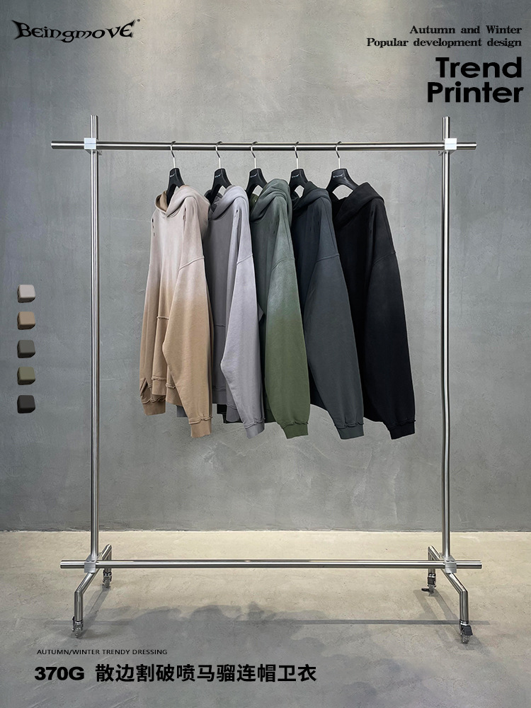 Calle secada| 2025 otoño estilo americano de moda alta calle in agujero agujero gradiente pulverización de caballo con chaqueta encapuchada hombre comercio exterior