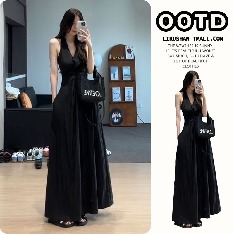 Elegant black halter-neck dress for women, autumn 2026 new collection, long and flowing, reaching the ankles, made of polyester