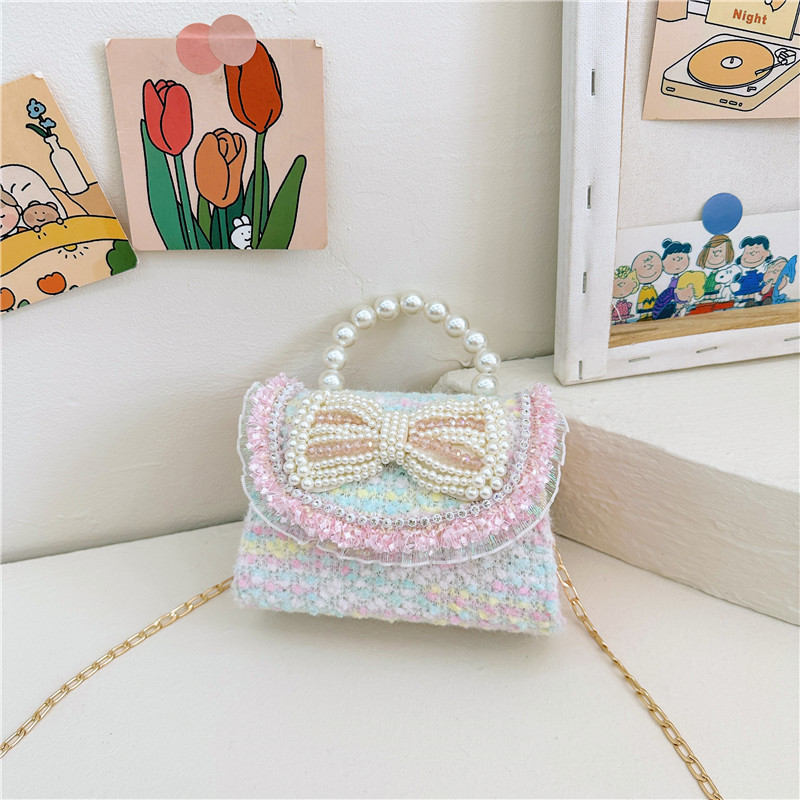 2025 primavera nuevo estilo lentejuelas lazo de perlas niña princesa mano mano accesorios diagonales bolso monedero