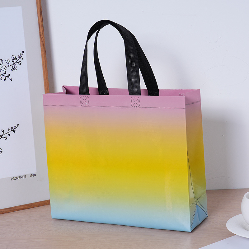 Bolsas de tela no tejida con película láser de tres colores de alta calidad, bolsas para hombres y mujeres de alto valor, grosor personalizado LOGO