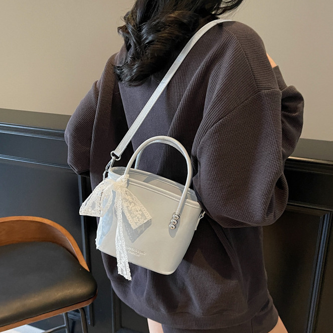 新款流单肩包潮水桶包包女森萌纯色质感复古手提简约斜挎包时尚中