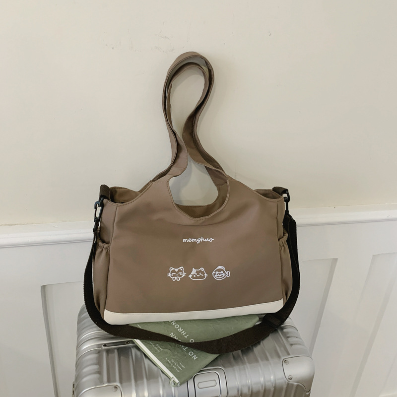 2026 nuevo lindo bolso de tote nicho de moda simple textura de viaje universal mujer gran capacidad mochila de hombro