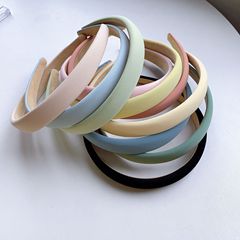 Simple, versatile solid-color hairband in springtime candy hues—sponge headband with built-in hair support, trendy online-style girls' forest-inspired accessory.