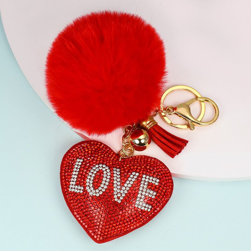 Venta caliente transfronteriza terciopelo coreano diamante color sólido amor corazón pelo bola llavero colgante bolso de las mujeres accesorios personalización