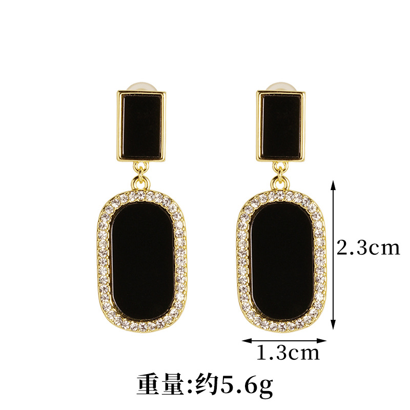 Vietnam Sha Jin moda elíptica micro-instalación de piedra de ojo de gato aleación de cobre de estilo europeo y americano joyas transfronterizas orejas no se desvanecen