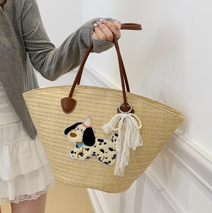 Venta caliente de verano bolso tejido caliente femenino 2025 nuevo bolso de cubo de playa de vacaciones bolso de paja de gran capacidad