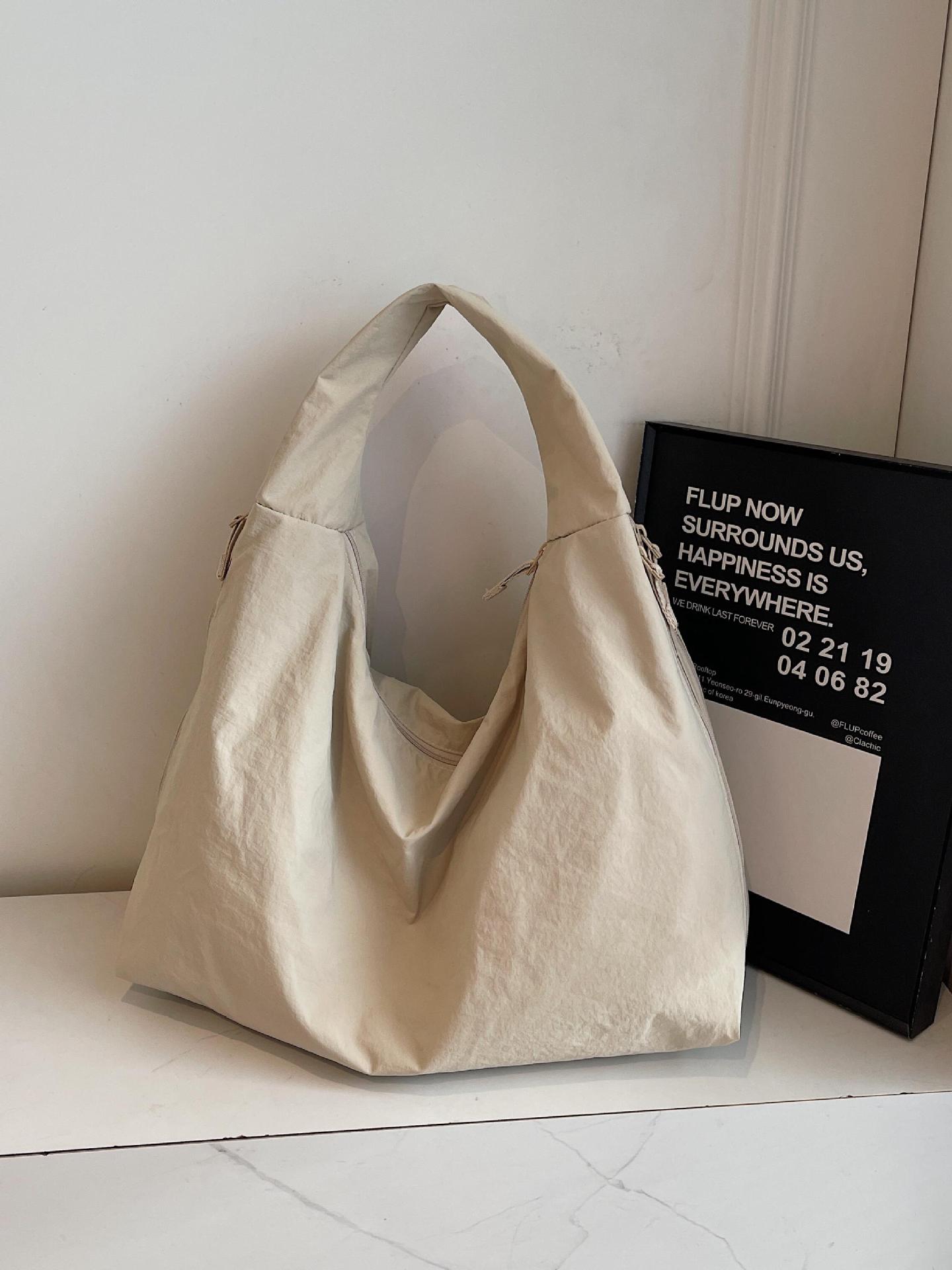 Bolso de axila de estilo explosivo de comercio exterior para mujer de gran capacidad 2025 nuevo bolso de hombro casual de tela de nailon bolso de moda simple