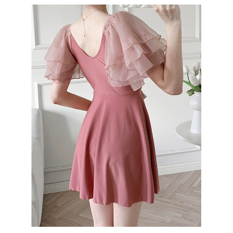 Dispositivo especial de despeje de baño unidireccional conservador para cubrir la piel delgada pecho pequeño reúnido manga de hoja de loto alta sensación de baño falso para mujeres