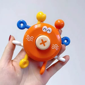 Сенсорная пальчиковая игрушка-вертушка с погремушкой