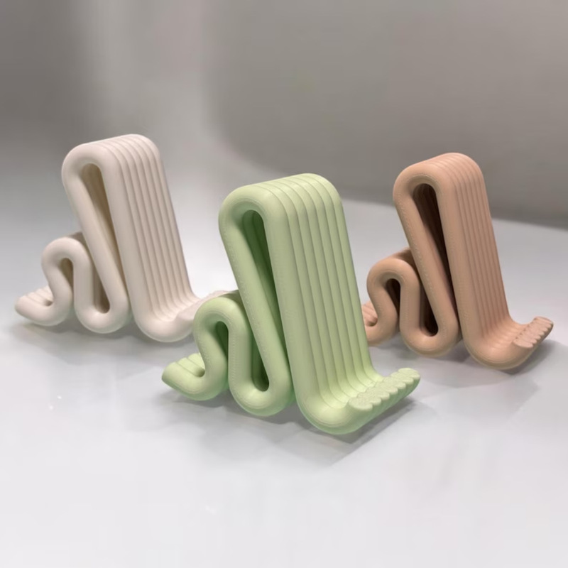 Cross-Border Modern Mobile Phone Stand – Simple Wave-Shaped Desktop Phone Stand, Stylish 3D Printed Office Organizer Cross-Border Modern Mobile Phone Stand – Simple Wave-Shaped Desktop Phone Stand, Stylish 3D Printed Office Organizer