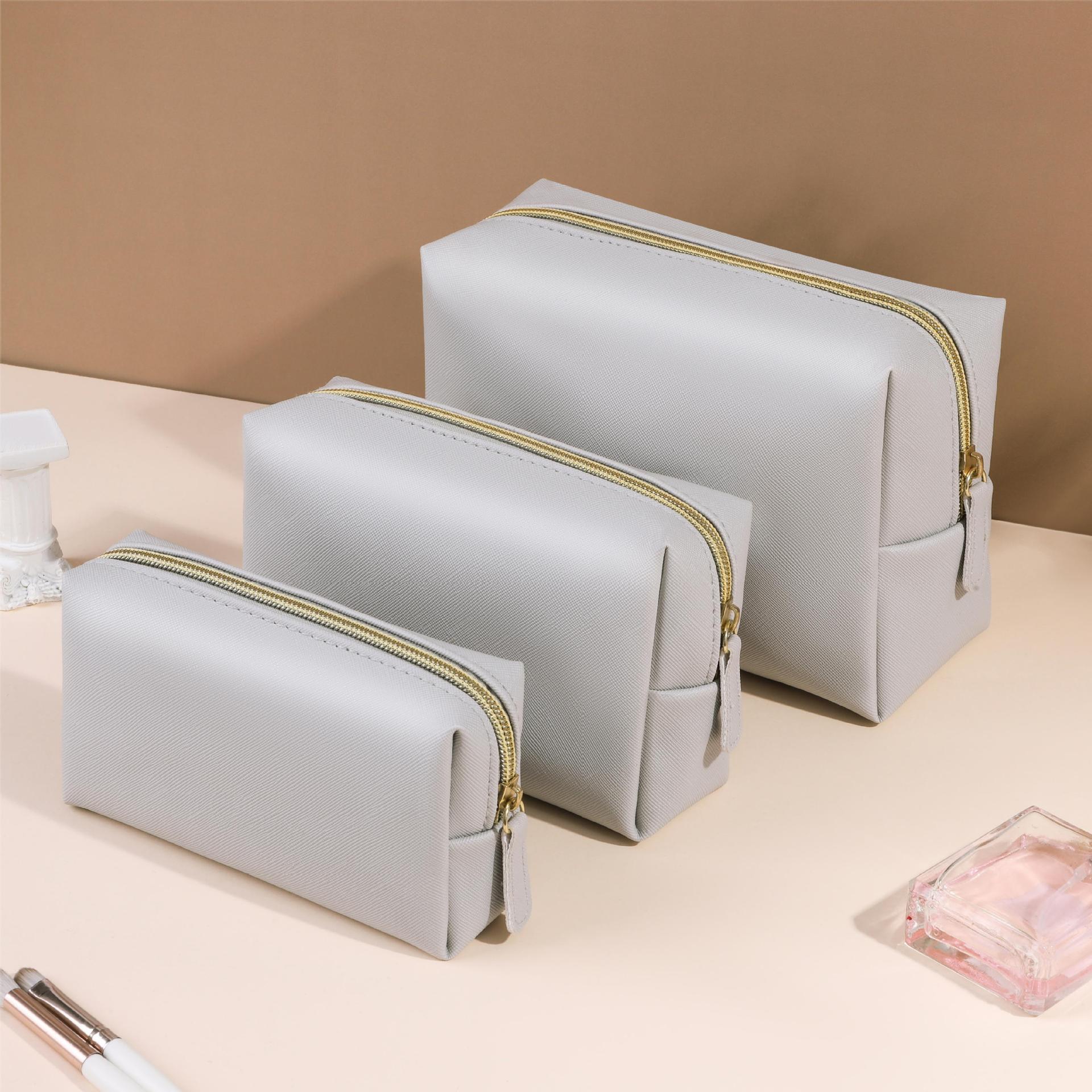 Nueva bolsa de cosméticos cuadrada PU, bolsa de almacenamiento portátil impermeable de alta calidad, bolsa de cosméticos octogonal para mujer, un lote