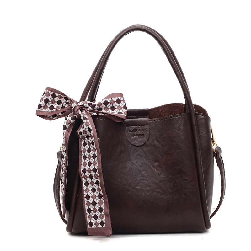 Bagos de transporte retro de estilo extranjero otoño y invierno 2025, nueva moda de un solo hombro, bolsas de cubo simples