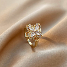 真金电镀铜镶锆石旋转四瓣花戒指轻奢ins冷淡风可调节钻戒气质指