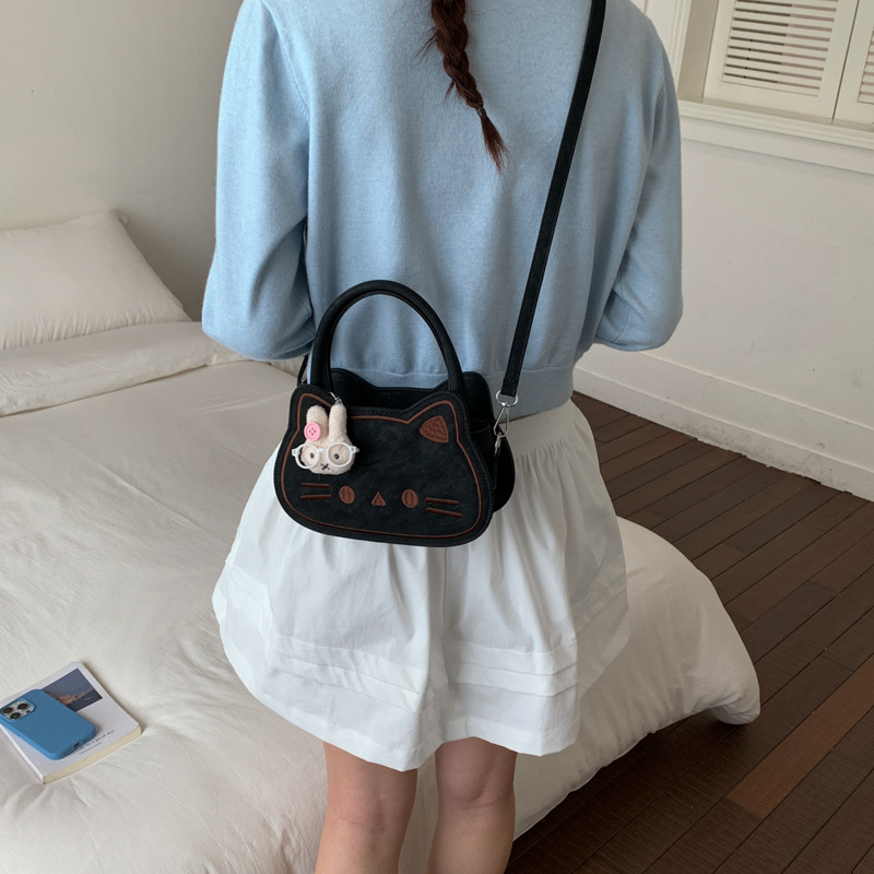 Diseño de nicho de dibujos animados pequeño bolso cuadrado adorable gato leche Hoh Hoh bolso de niña de moda de viaje de hombro mochila image 4