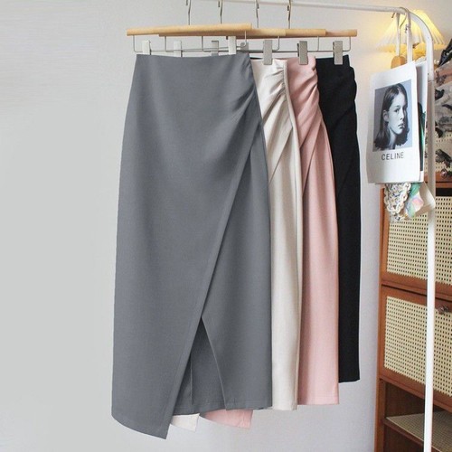 A mid-length dress with a high waist, featuring an irregular hemline, side slits, and a fitted silhouette, combining the style of a tailored blazer with the flair of a autumnal pleated skirt.