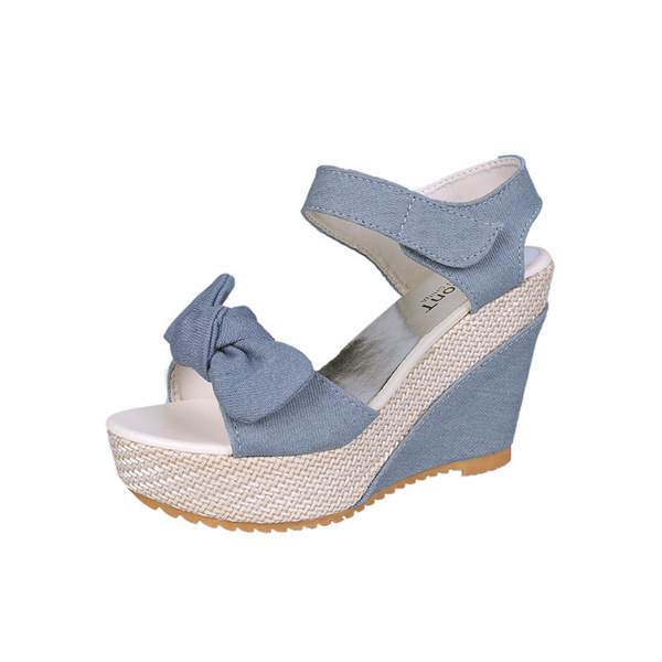 Summer fashionable cute sandals with a strap with bow wedge heel…