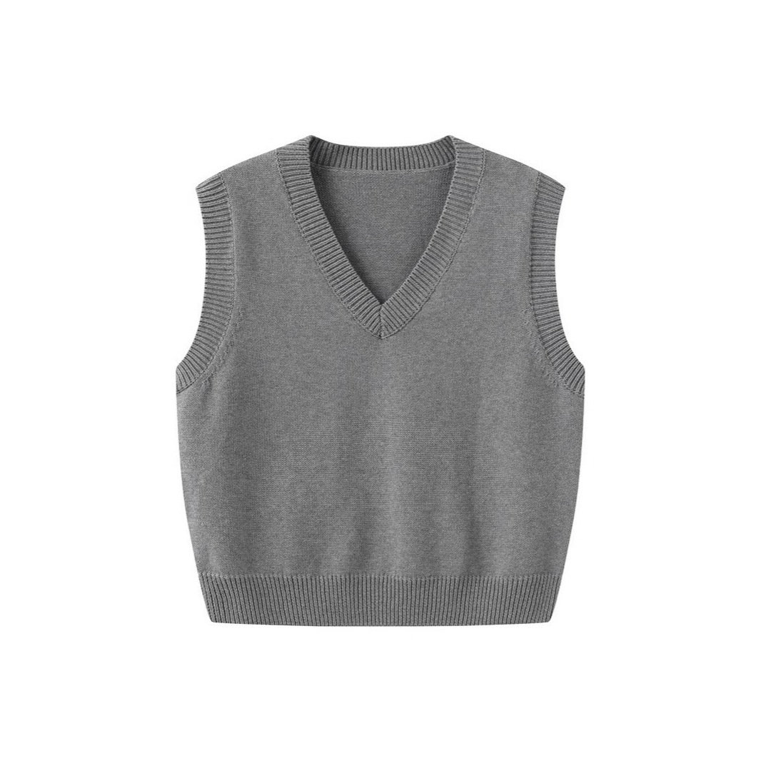 Women's knitted vest, spring and autumn, V-neck, gray sleeveless pullover sweater vest, layered over a cardigan.