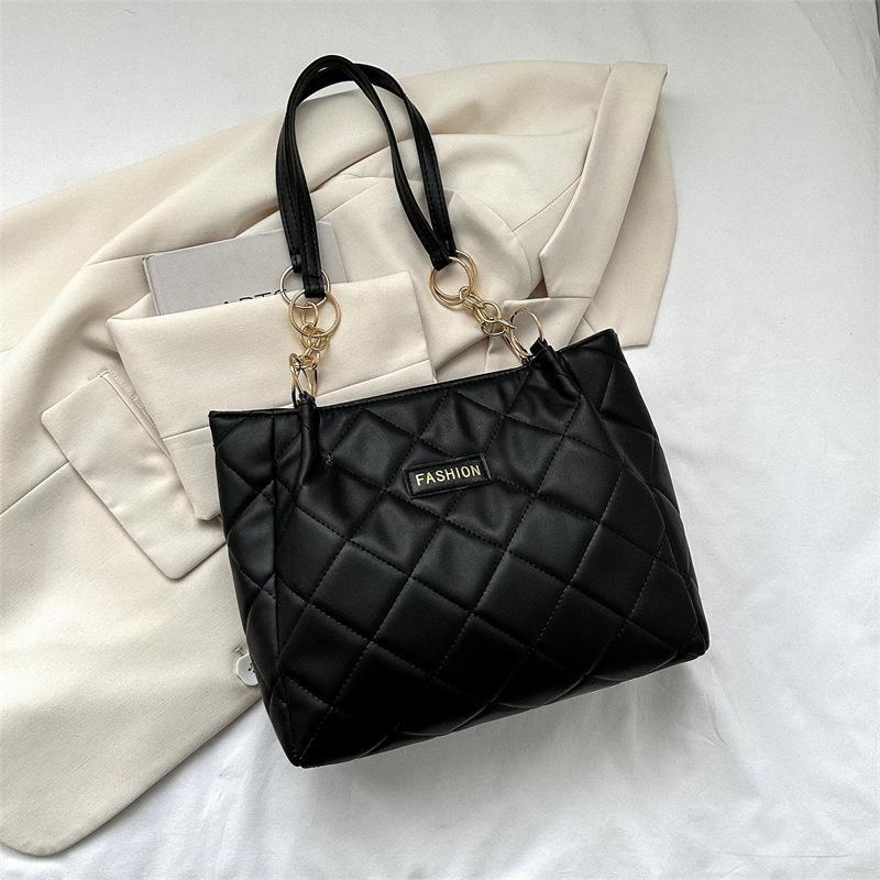 Bolso de gran capacidad de ocio para mujeres 2023 primavera nueva simple estilo extranjero de transporte de mochila de moda textura tote