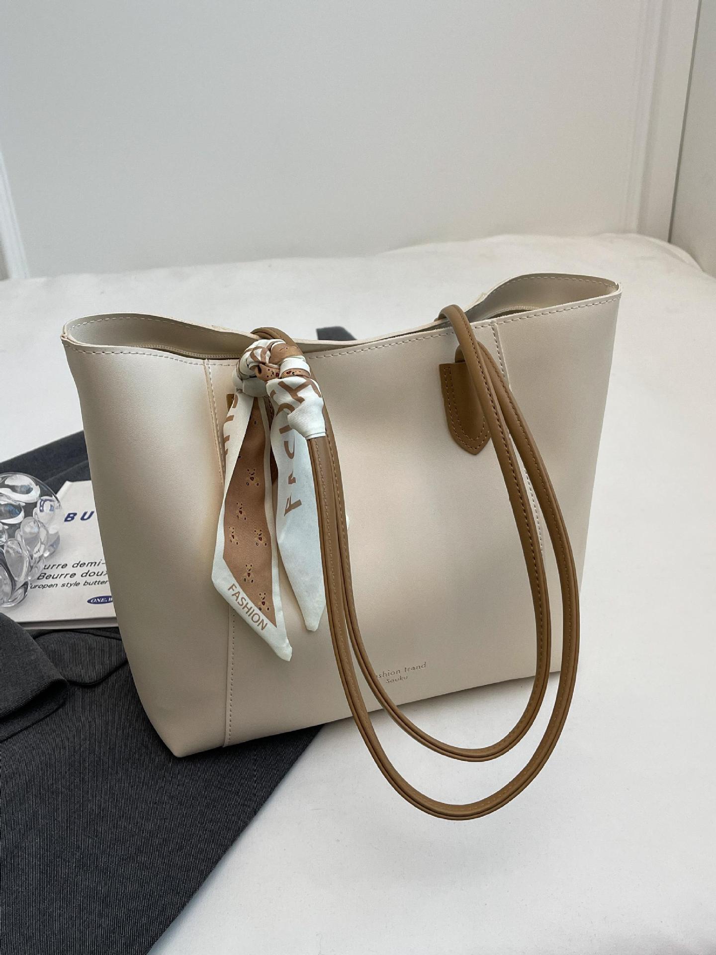 Bolsa de viaje transfronteriza de gran capacidad para mujeres 2025 nueva moda universal simple bolso de hombro axilar