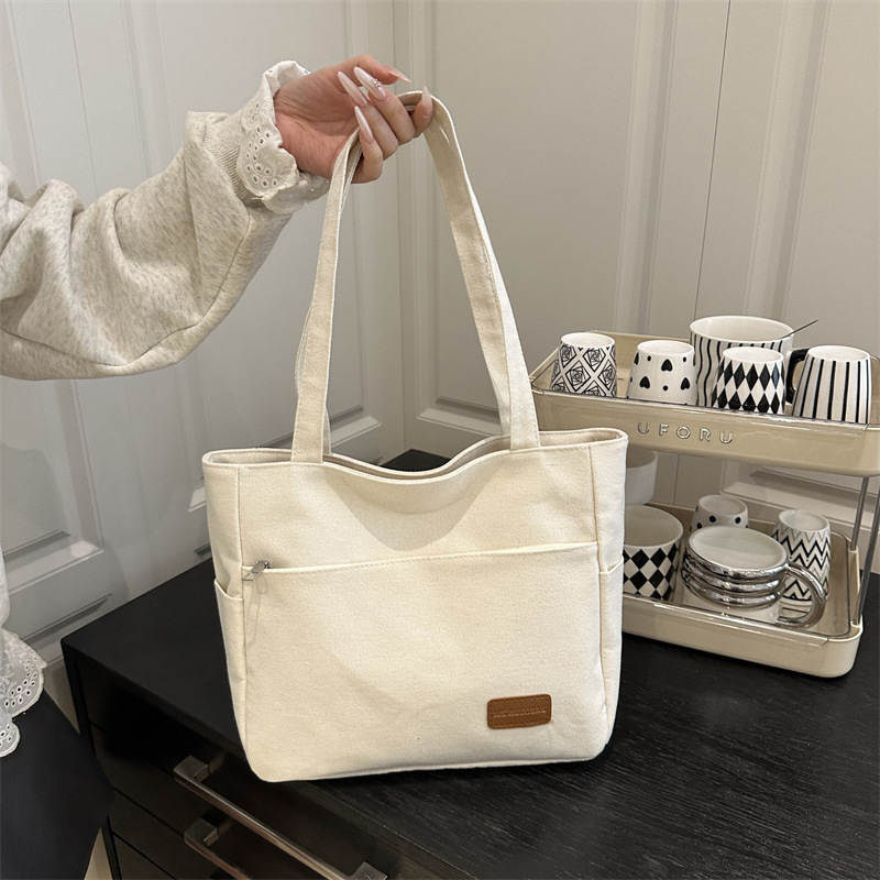Bolsa de lona de alta capacidad para mujeres japonesas simple versátil bolso de hombro de viaje de estudiantes bolso especial