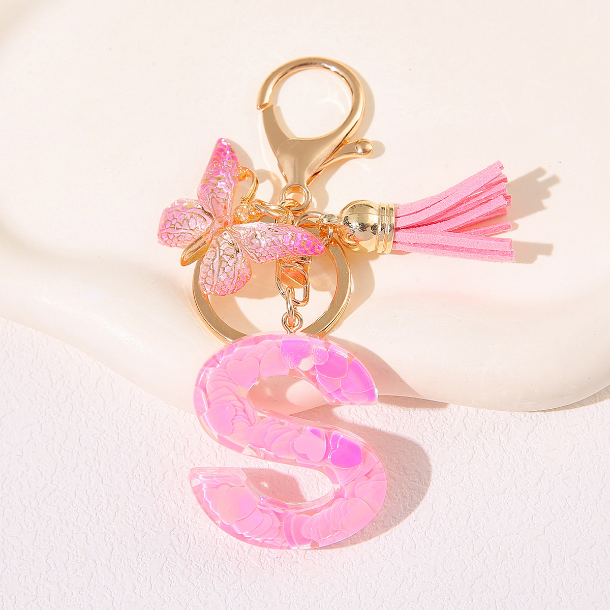 Nuevo rosa damas letras A-Z llavero de goteo de goma sequilla amor letras bordas mariposa llavero transfronterizo