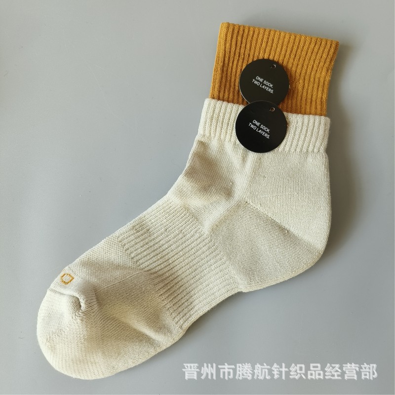 蘇万ナイキの靴下のカラーの二重は男女の中で長い筒のタオルの底のスポーツの靴下をつなぎ合わせてバスケットボールの靴下を走ります。