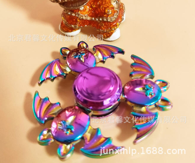 B Dedos de araña de colores, peonza, yema del dedo de metal de tres hojas, peonza de dos hojas, productos pequeños, suministro al por mayor