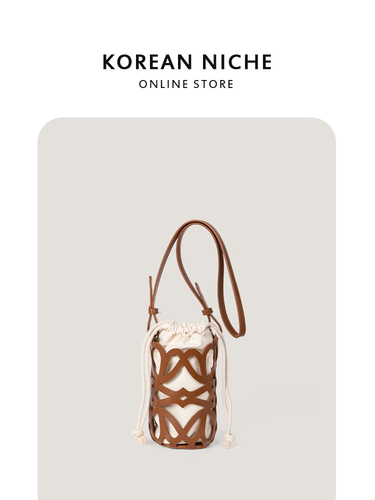 Nuevo bolso bandolera cilíndrico de lona con cordón y diseño coreano de nicho, para mujer, de alta gama, único y versátil.