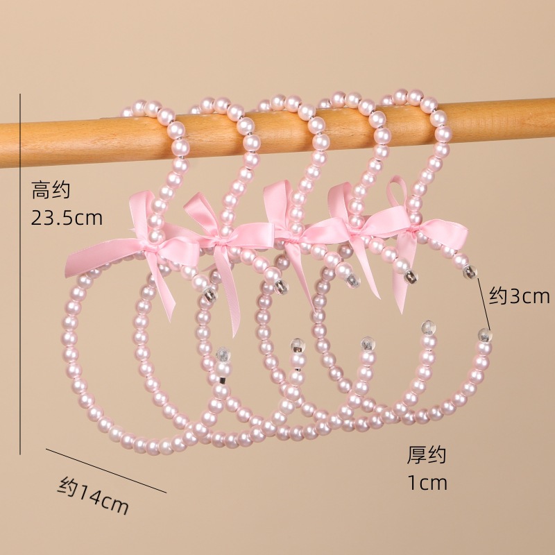 Tienda de ropa de mujer perla lujo ligero vestido retro arco adulto percha de ropa infantil estilo europeo hadas soporte de abrigo