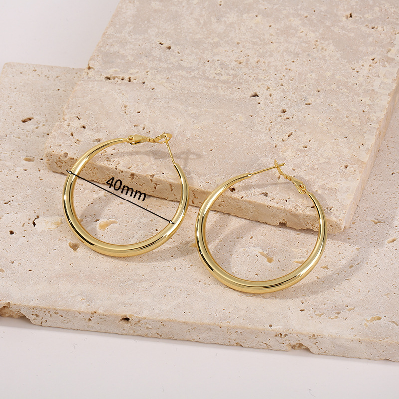 Amazon moda popular cobre plateado 18K oro hueco brillante pendientes creativo europeo y americano exagerado Comercio exterior pendientes al por mayor