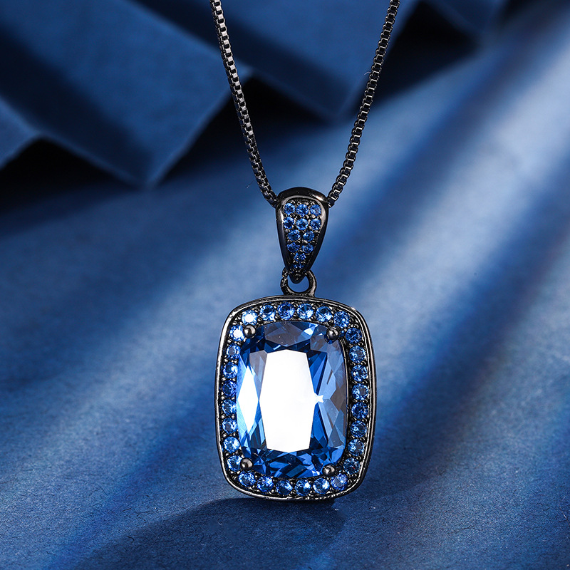 Zhuang Shengsheng Jewelry Fondo de cobre chapado en oro simulación corindón rojo cristal puntiagudo azul temperamento cuadrado gordo traje de oro negro mujer 10*14