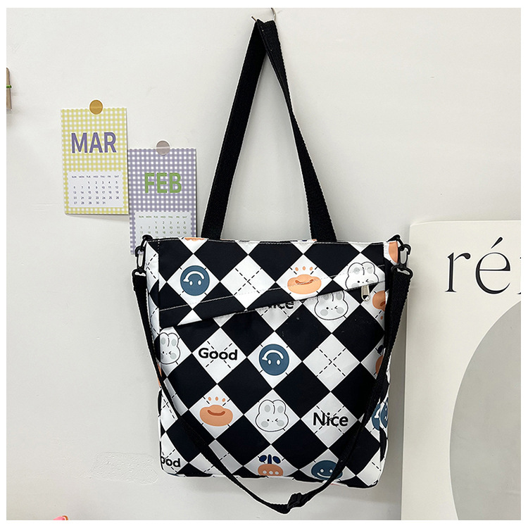 New nylon large-capacity hand-held student storage bag, cute cartoon outdoor bento bag, high appearance level single-shoulder women's bag undefined