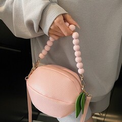 外国貿易2025春の新型個性かわいいレモンバッグの流行は、小さな丸いチェーンの少女のショルダーバッグを斜めに掛けます。