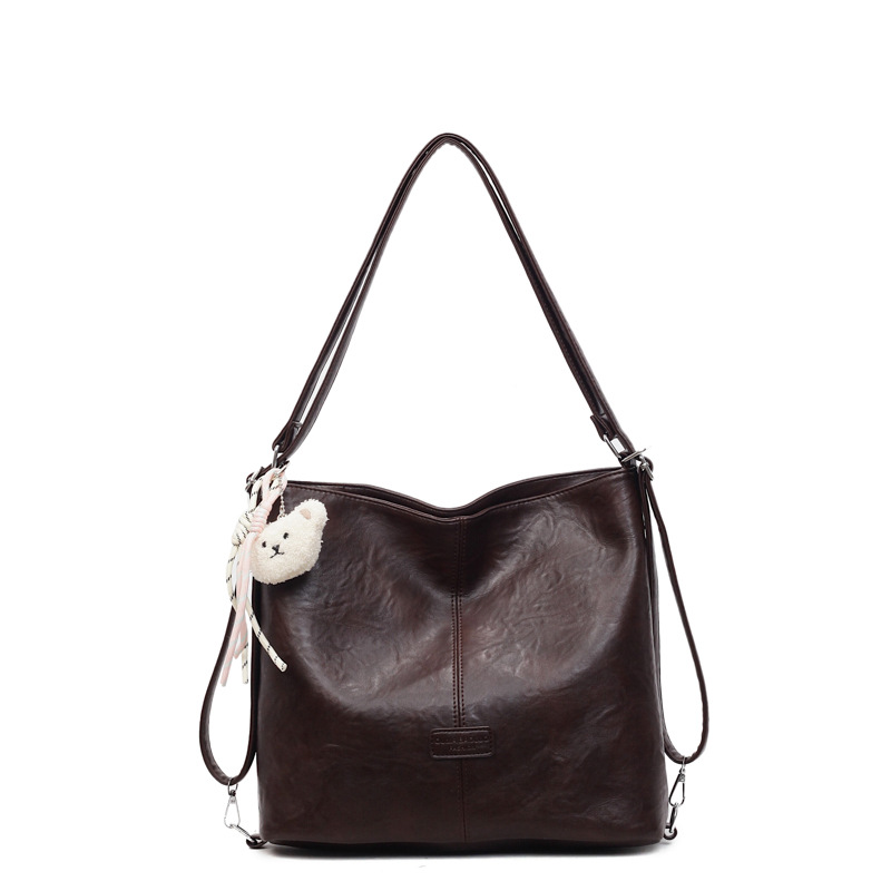 Bolsa de hombro retro transfronteriza de cuero suave de gran capacidad bolsa de cubo de agua para mujeres 2025 nueva simple mochila de viaje ocio