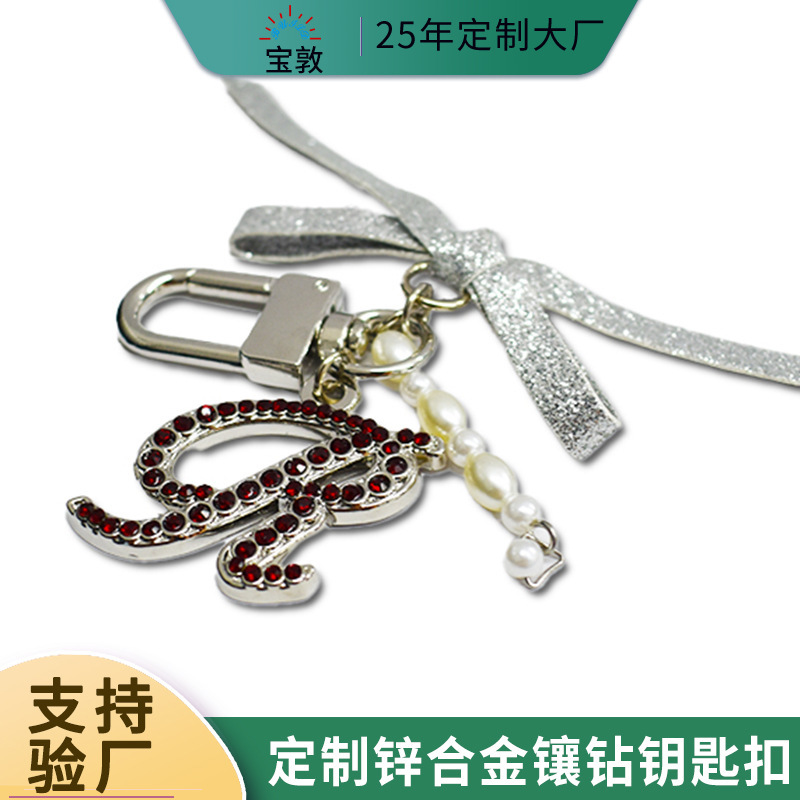 Creative Diamond-Encrusted English Letter Keychain with Bow and Pearl Combination Metal Keychain for Girls' Bags and Accessories Creative Diamond-Encrusted English Letter Keychain with Bow and Pearl Combination Metal Keychain for Girls' Bags and Accessories