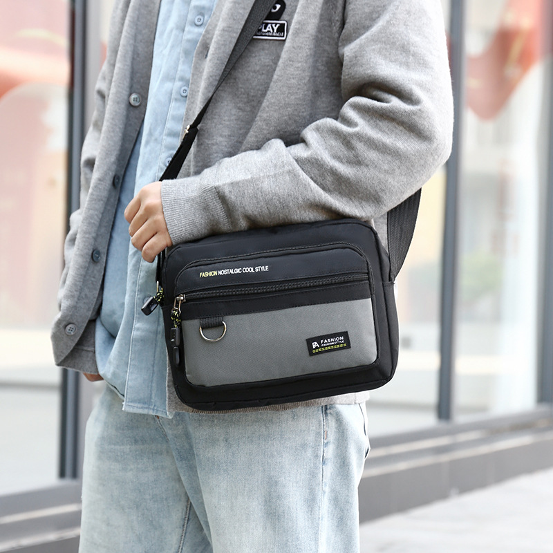 Bolso bandolera horizontal para hombre nuevo Bolso de hombro casual de tendencia transfronteriza Bolso de hombre de negocios de almacenamiento multicapa simple de moda