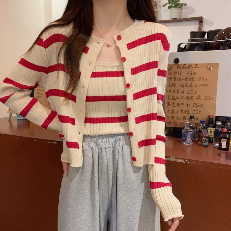 韓国の秋のストライプの2つのセットのニットの丸首の長袖のカーディガンのコートのサスペンダーのベストの女性の百合のカジュアルなファッション|undefined