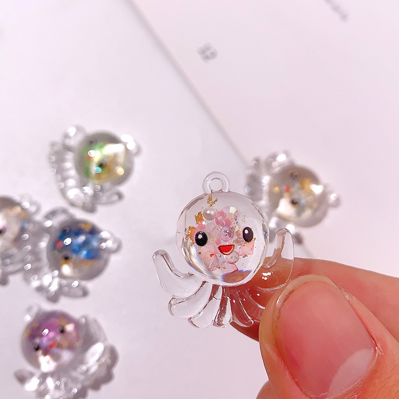 Nuevos accesorios de pulpo nocturno marino serie de cristal octopus llavero colgante DIY material pendiente