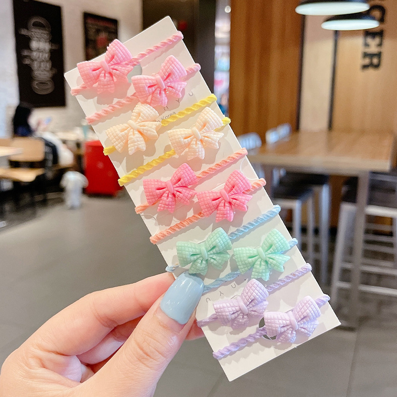 Las muchachas de la cuerda del pelo del color del caramelo no hacen daño al pelo pequeña tira de goma Lazo de la cuerda del pelo tocado niños lindos cubierta de cuero de la banda del pelo del bebé