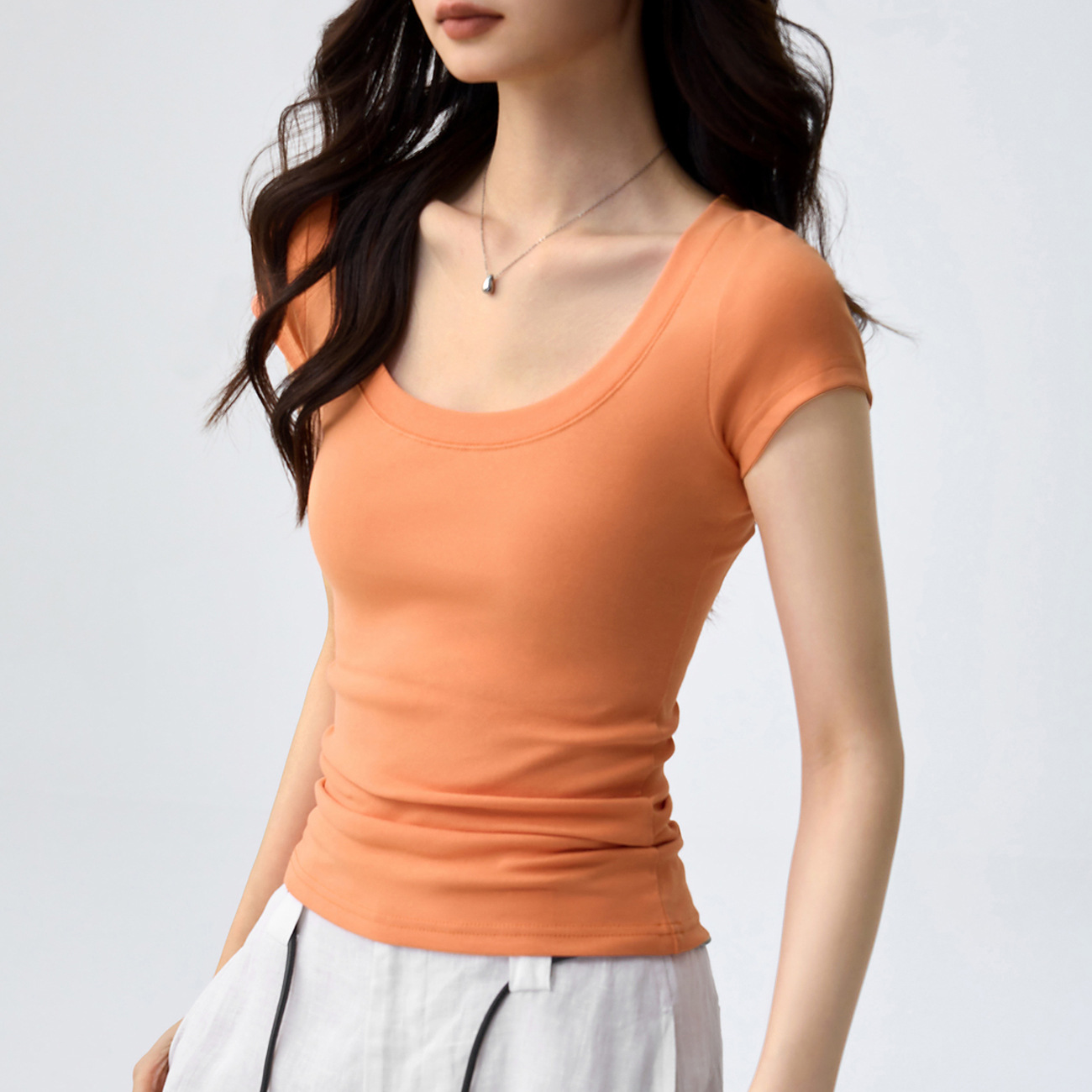 Camiseta de algodón puro de alta calidad para mujer, manga corta, corte ajustado, cuello redondo, sexy y ceñida, top de verano 2026, camiseta básica de color liso.