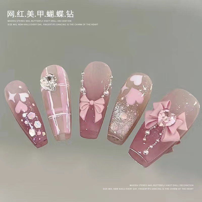 Celebridad en línea guerrero arco accesorios de uñas super flash todo partido tridimensional pila diamante amor accesorios de uñas al por mayor