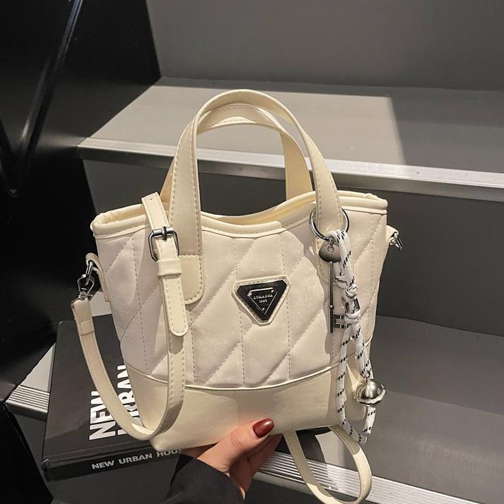 Bolso de cubo portátil de diamante de fuego súper caliente para mujer 2025 nueva tendencia bolso de hombro de todo fósforo bolso de mensajero de moda de nicho transfronterizo