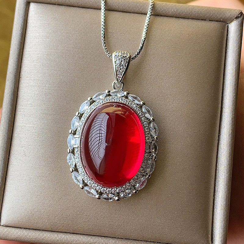 2024 nuevo estilo Zhuang Shengsheng joyería simulación paloma sangre rojo corindón cristal puntiagudo azul superficie lisa colgante retro maestro 15*20