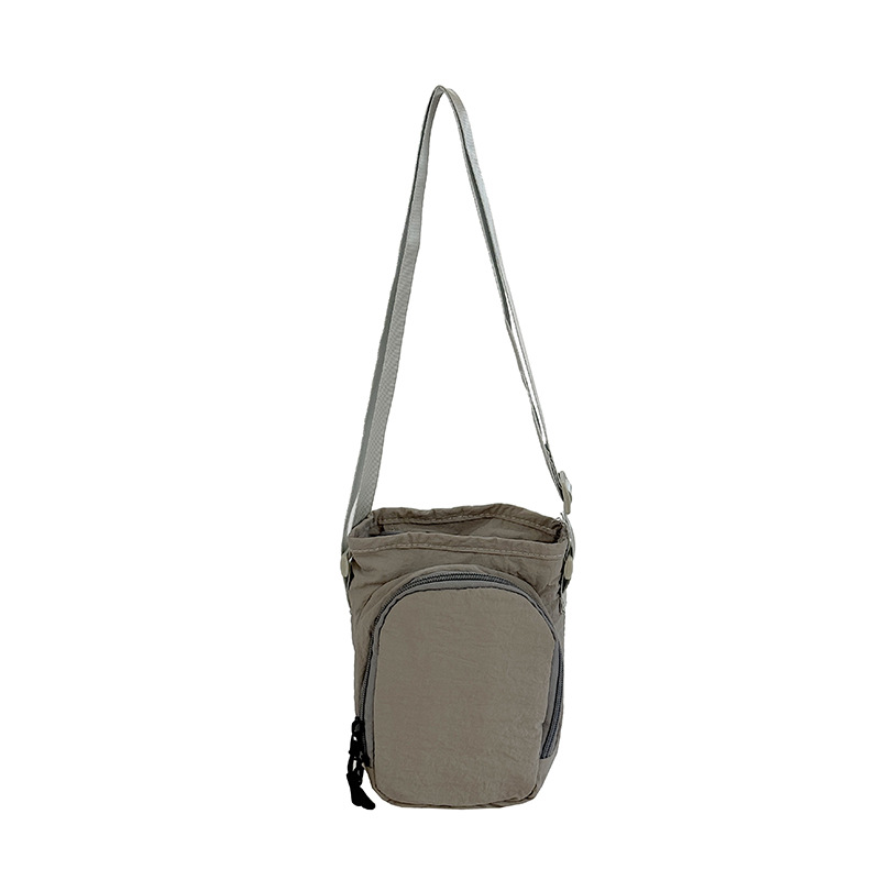 Diseño de nicho bolso de teléfono móvil ligero portátil al aire libre para mujeres bolso de hombro simple hervidor de agua para viajar bolso de cambio universal