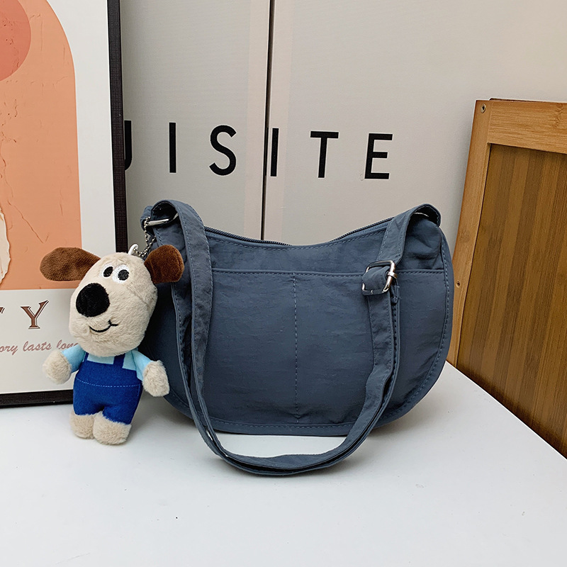 Bolsa de hombro coreana para niños y niñas de color sólido de gran capacidad bolsas de饺os para niños 2025 nuevas bolsas para niños con colgantes