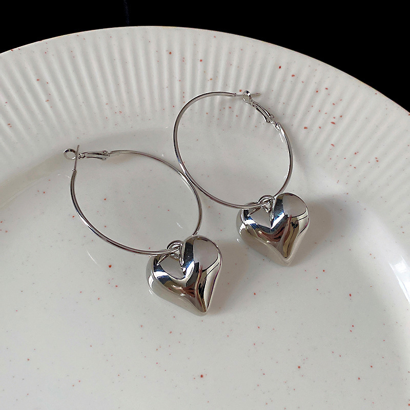 Pendientes de alta gama de lujo ligero transfronterizo de aguja de plata de galvanoplastia de oro real, pendientes de personalidad de nicho, pendientes de alta gama de moda al por mayor