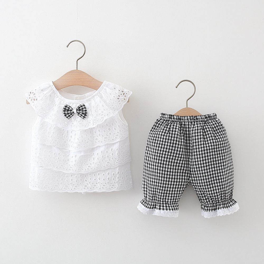 Summer new children's clothing wholesale white hollow top plus small plaid shorts girls two-piece suit one generation